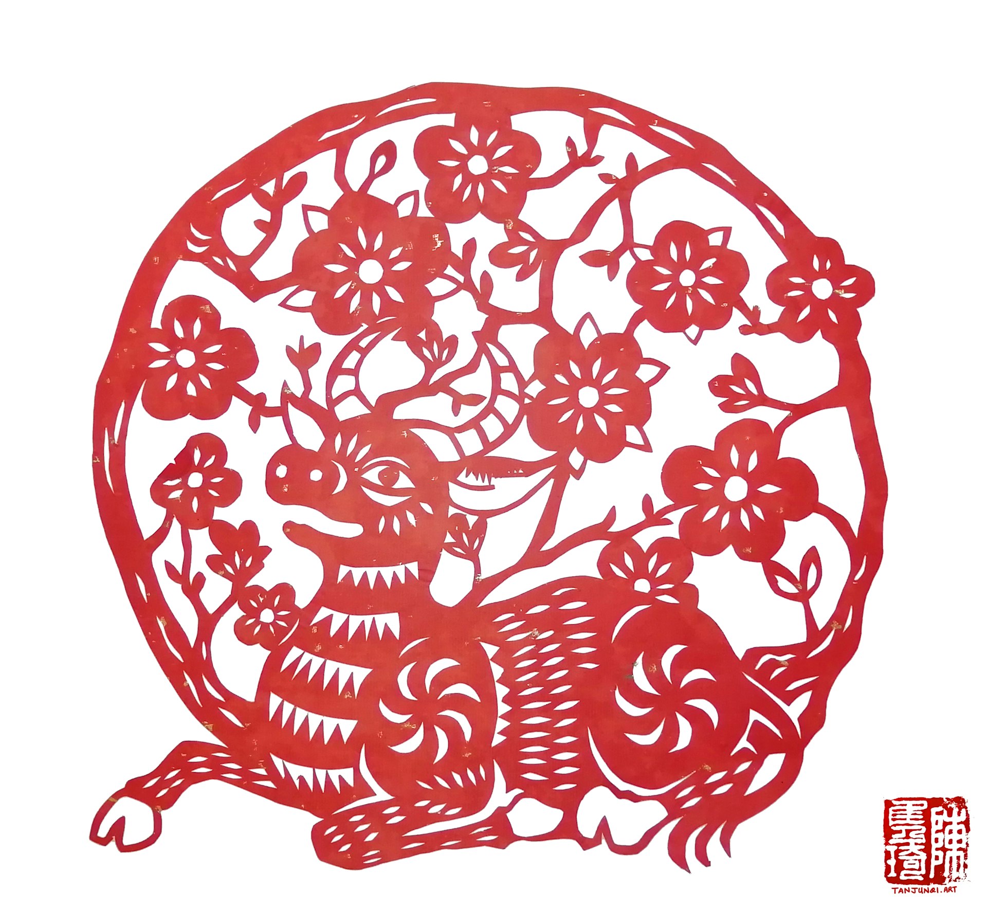 Chinese papercut of a calf resting under the shade of cherry blossoms