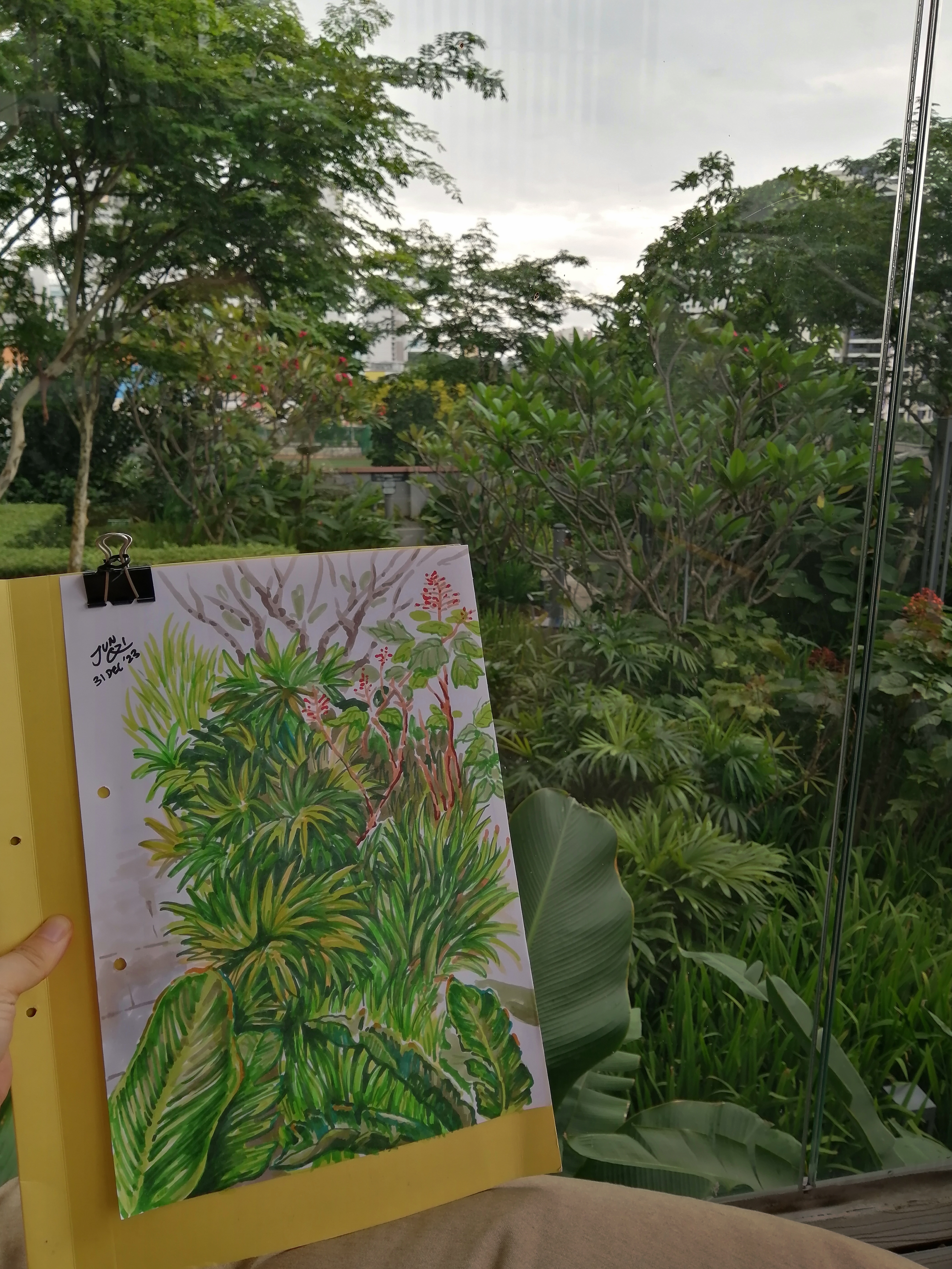 Photo of my artwork against the place I was sketching.